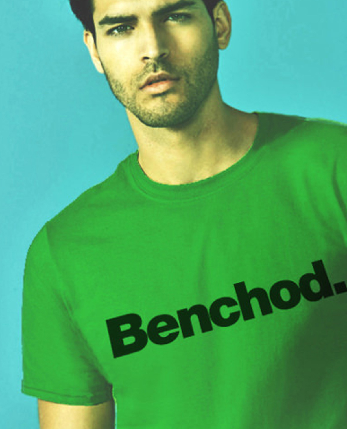 South Asian male model wearing Benchod. green SoftStyle South Asian Desi Themed Graphic Design t.shirts by Brown Man Clothing Co.