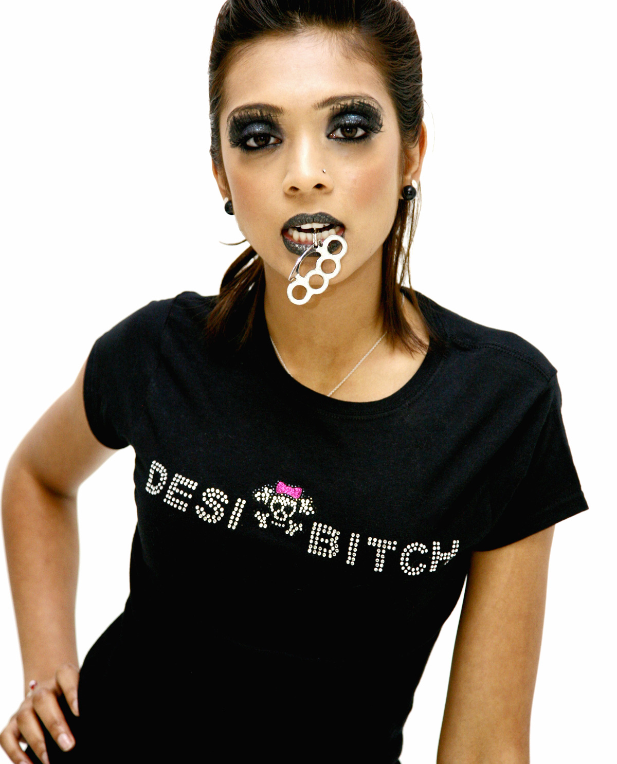 South Asian female wearing Desi Bitch rhinestone shirt.