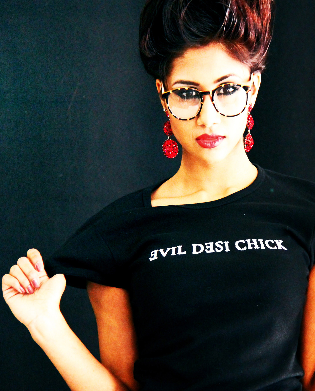 South Asian Female model wearing black fitted American Apparel t.shirt for women with Evil Desi Chick silkscreened on the front.