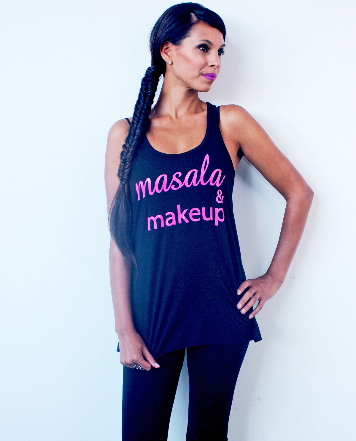 South Asian female model wearing racerback black tank top with Masala & Makeup written on front. South Asian Desi Themed Graphic Design t.shirts by Brown Man Clothing Co.
