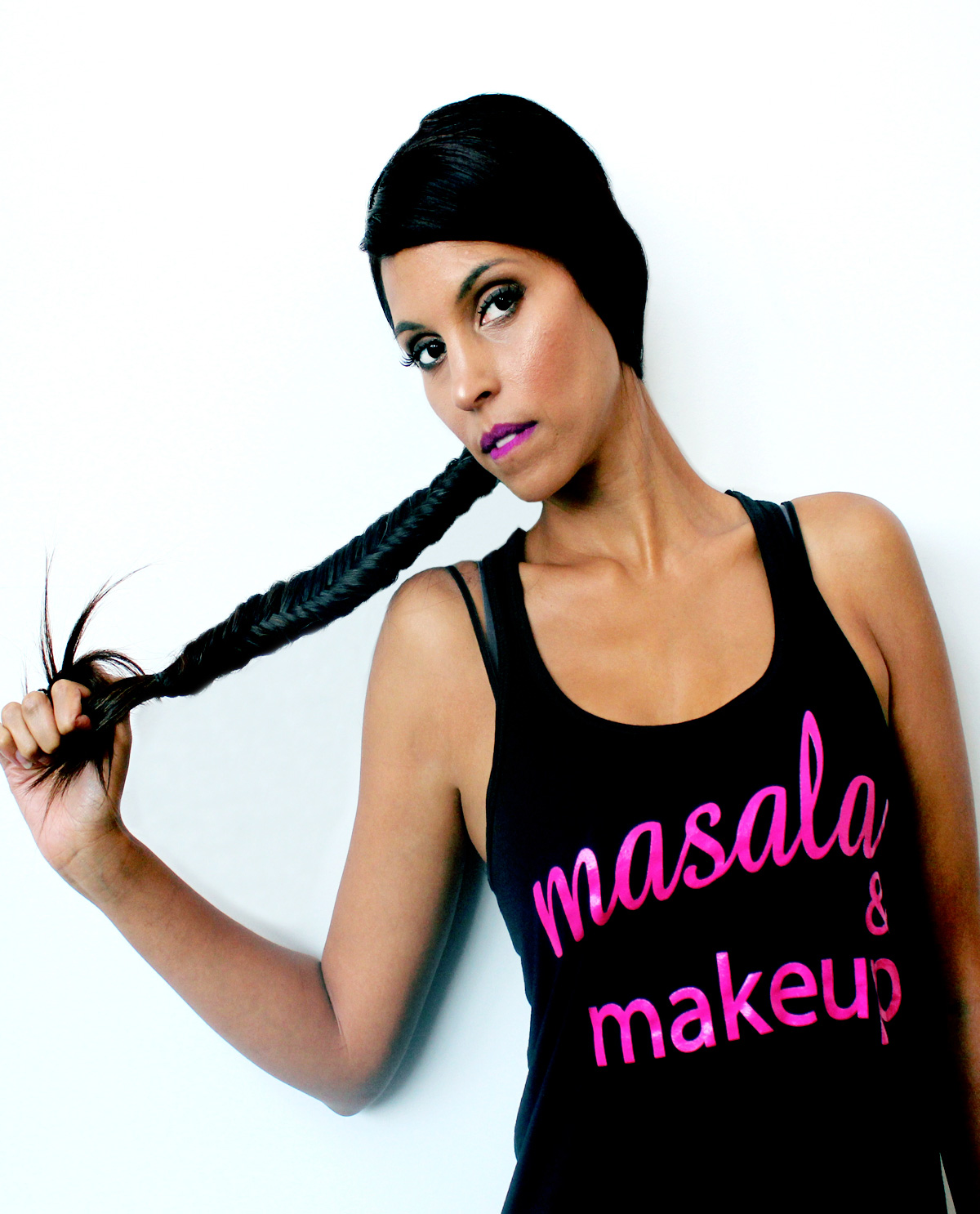 South Asian female model wearing black racerback tank top with Masala & Makeup graphic design t.shirt. South Asian Desi Themed Graphic Design t.shirts by Brown Man Clothing Co.