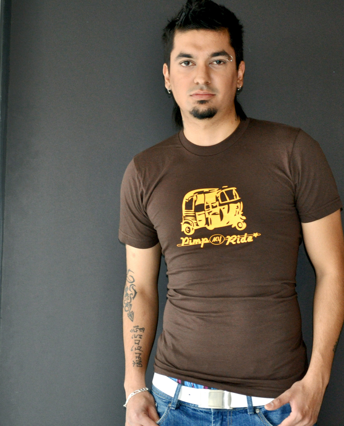 South Asian male model wearing Pimp My Ride illustrated design printed on SoftStyle brown American Apparel Jersey T.shirt fitted t.shirt. South Asian Desi Themed Graphic Design t.shirts by Brown Man Clothing Co.