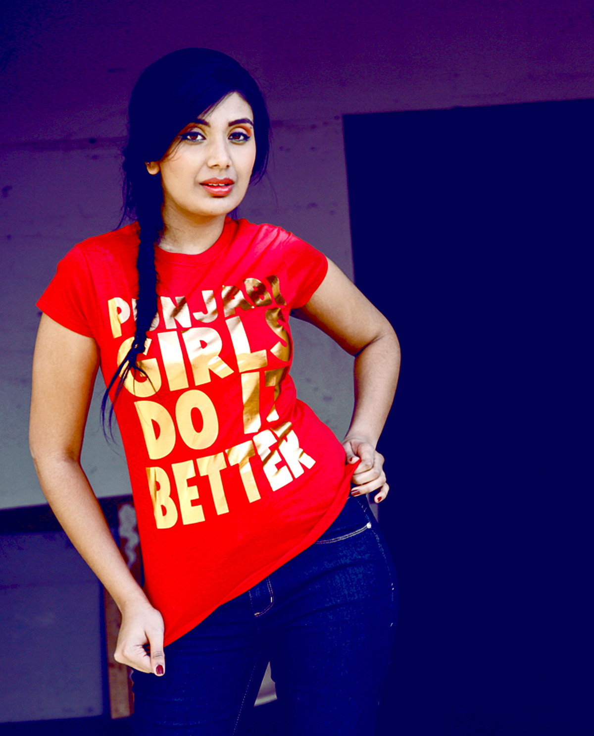 South Asian Female Model wearing Red Copper Foil Lettering T.shirt on Red Fitted shirt that says Punjabi Girls Do It Better. Graphic design t.shirts by Brown Man Clothing Co.